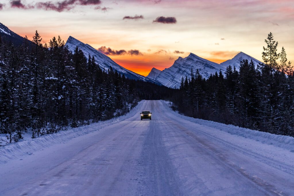 Driving the Icefields Parkway from Jasper National Park to Lake Louise at sunrise during the winter in Alberta, Canada