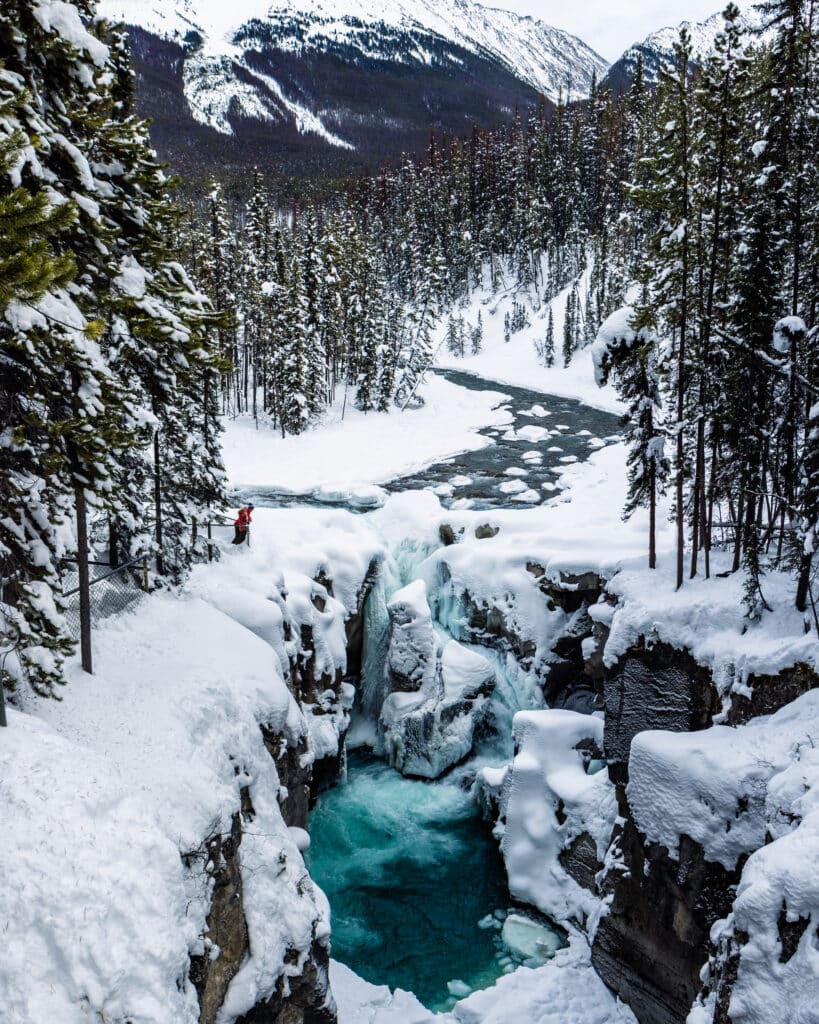 Sunwapta Falls covered in snow along the Icefields Parkway drive in Jasper National Park during the winter