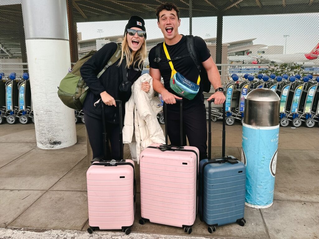 The Lovers Passport at the Airport with suitcases