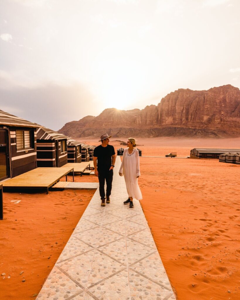 Couple walking around Bedouin Camp in Wadi Rum, Jordan