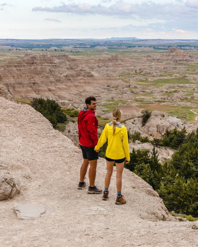 adventure couple overlooking panoramic viewpoint