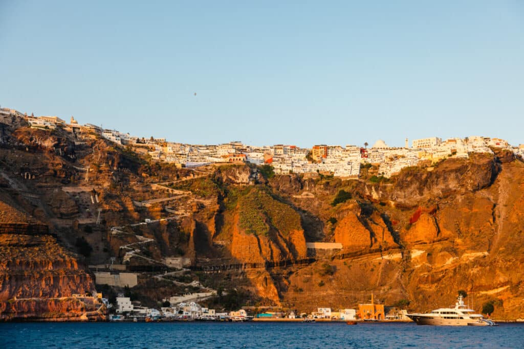 Views of Santorini from a cruise ship at sunset