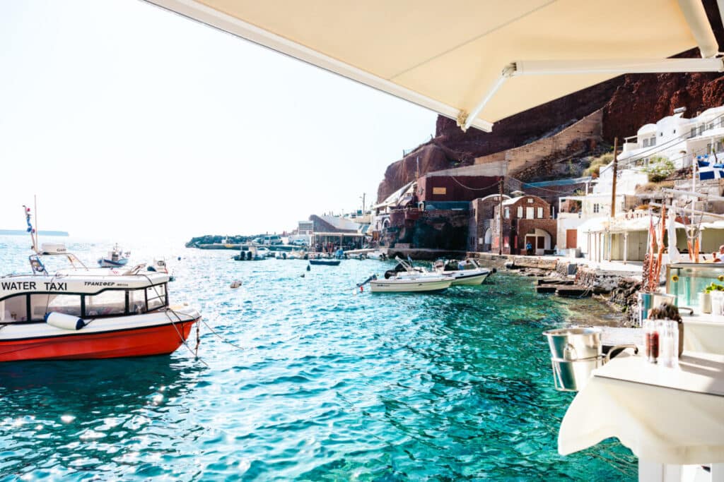 Water Taxi in Oia Village, Santorini stationed outside of Ammoudi Bay 