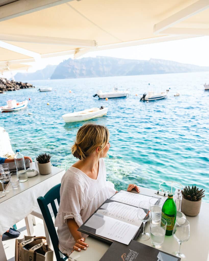 Eating at a restaurant in Oia, Santorini in Ammoudi Bay