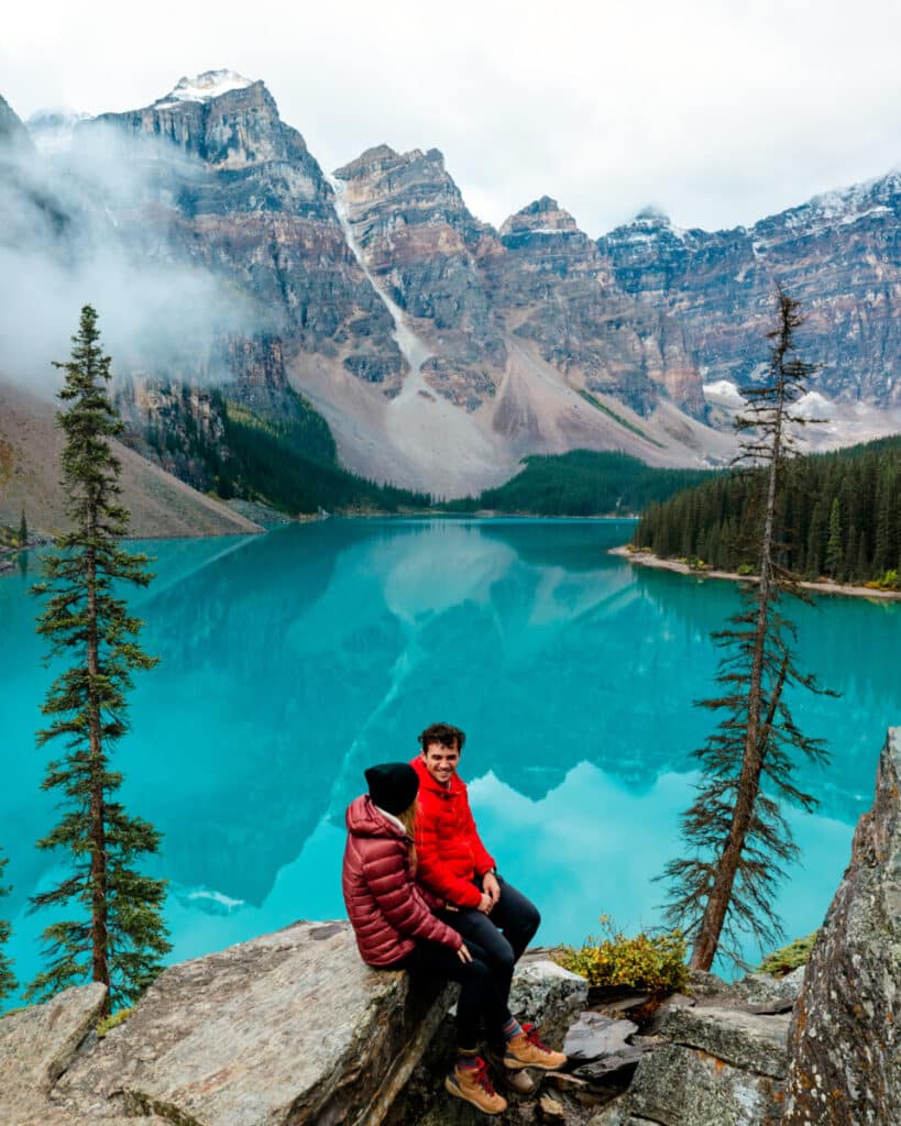 couple watching the sunrise on Moraine Lake