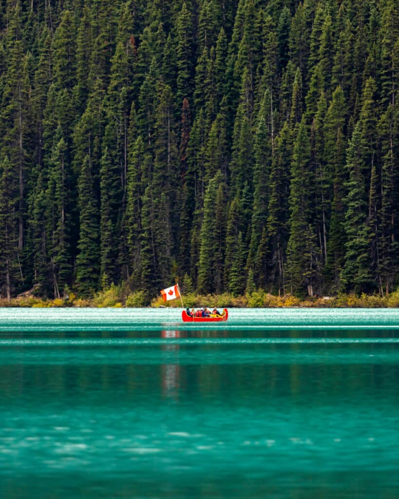 Canoe paddling out on Lake Louise in Banff