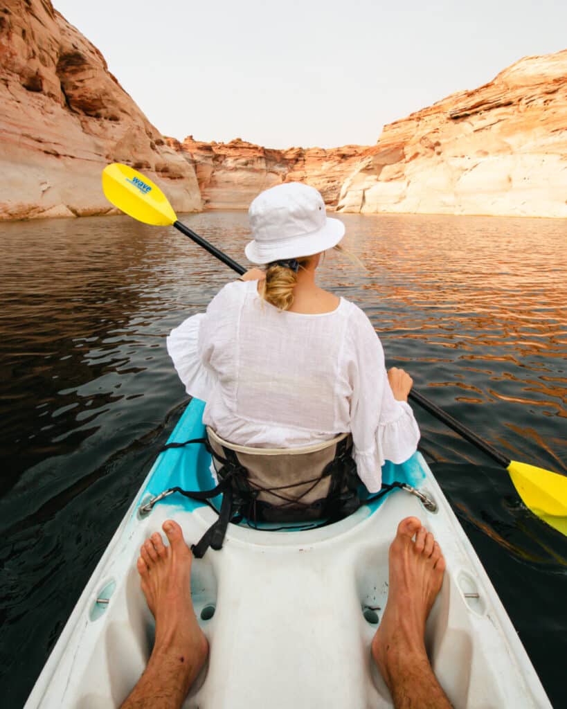 woman kayaking through antelope canyon