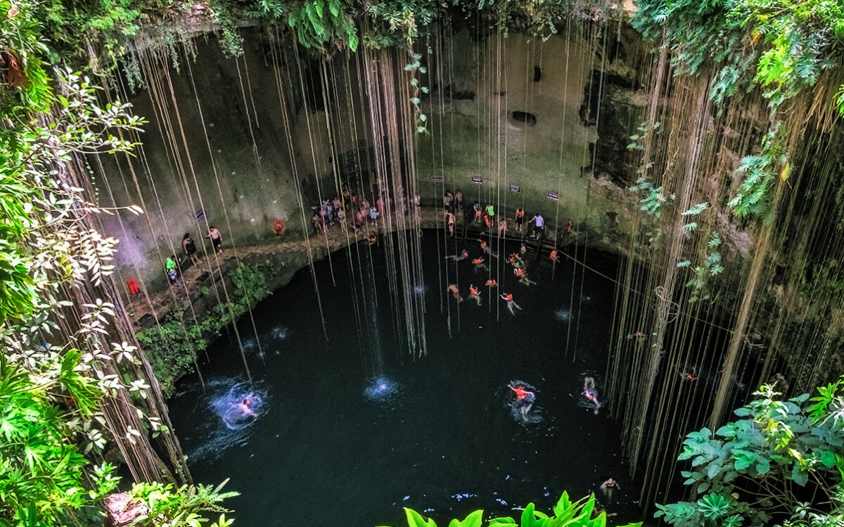 People Visiting a Cenote