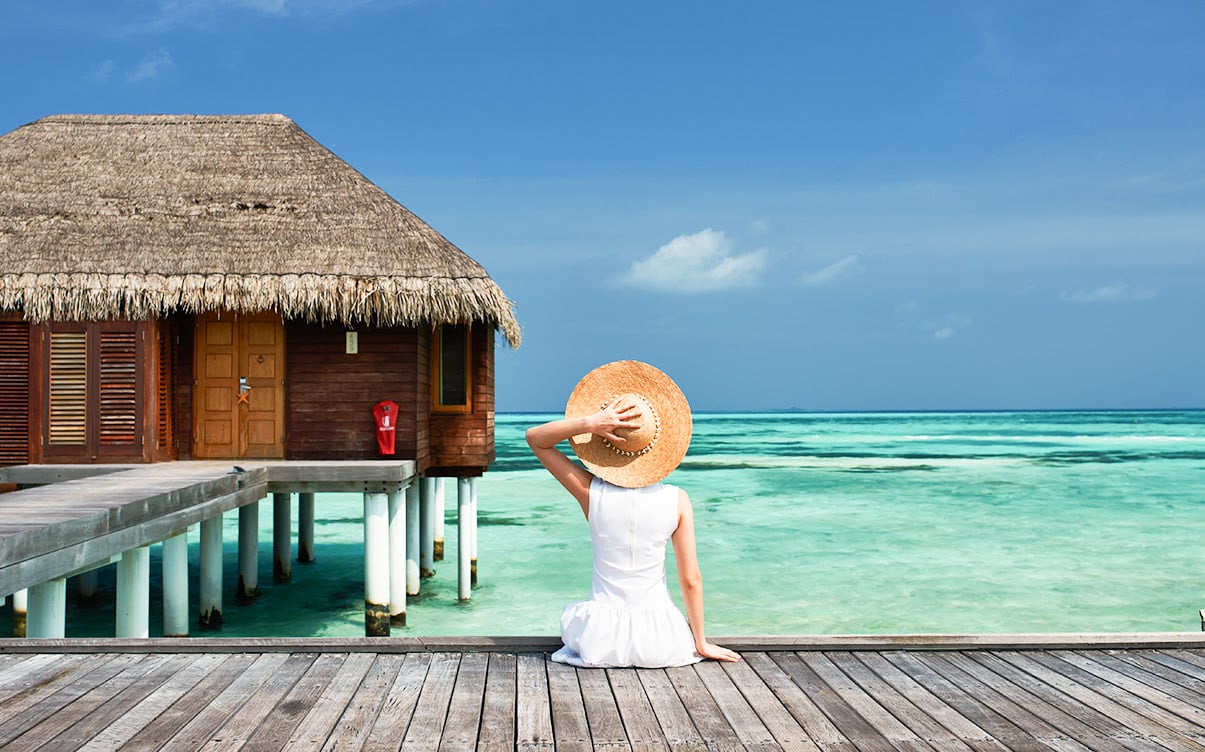 A Sitting Woman Overlooking the Ocean in the Maldives