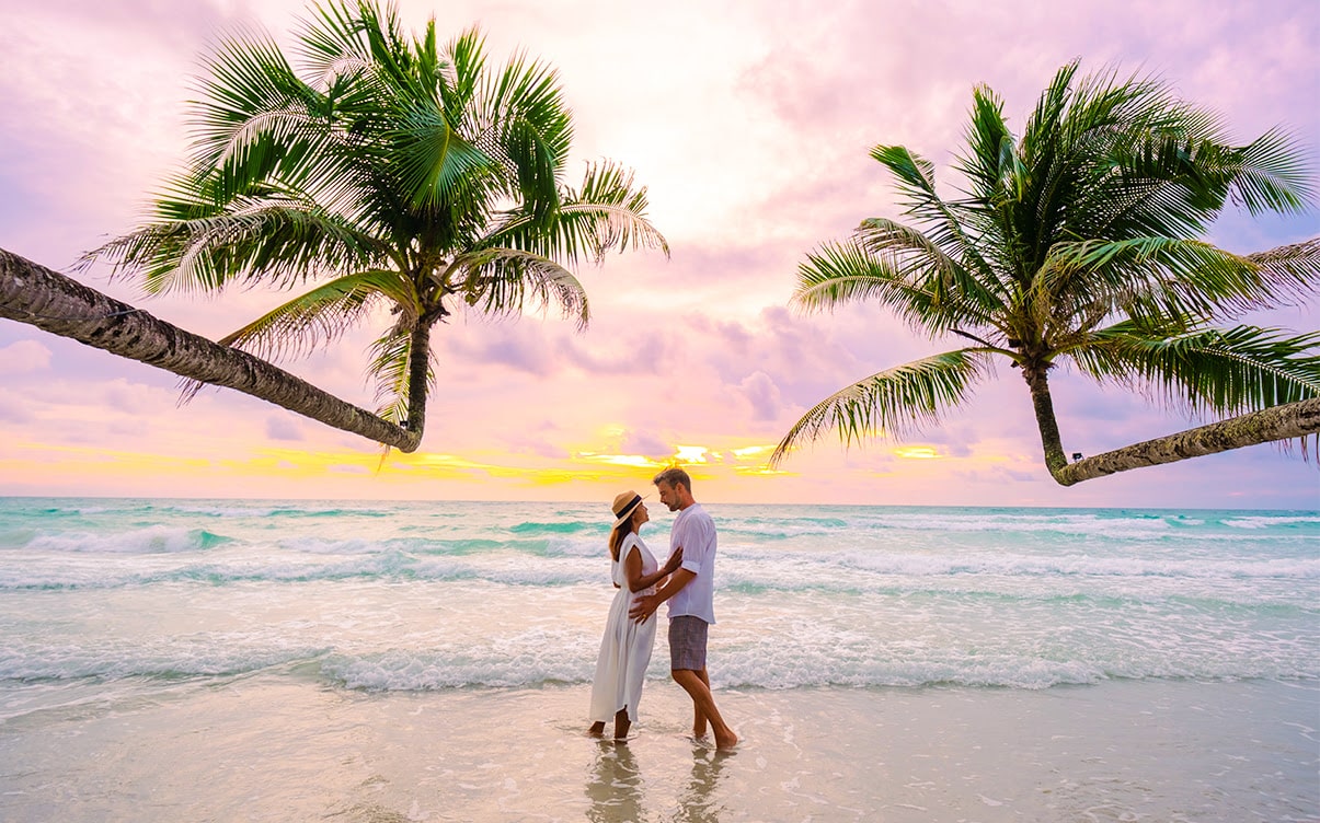 A Couple on a Beach at Sunset