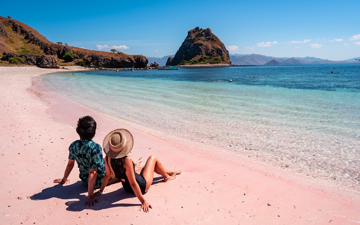 A Couple on the Pink Beach in Komodo Island Indonesia