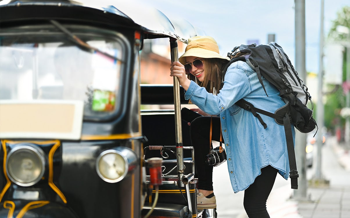 A Woman Traveling Via Tuk Tuk