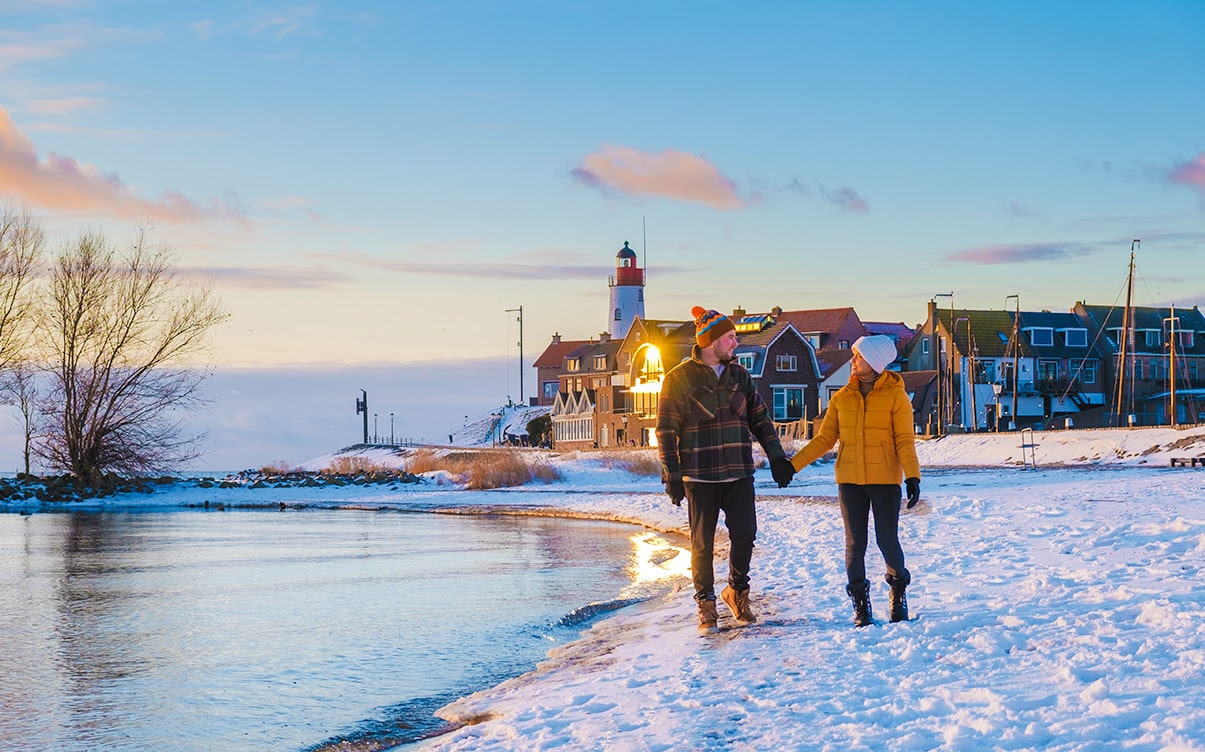 A Couple Walking on a Beach in Winter