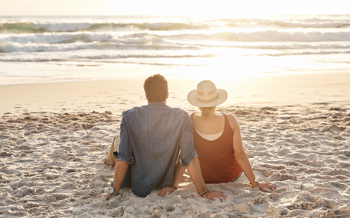 A Couple Sitting on a Beach