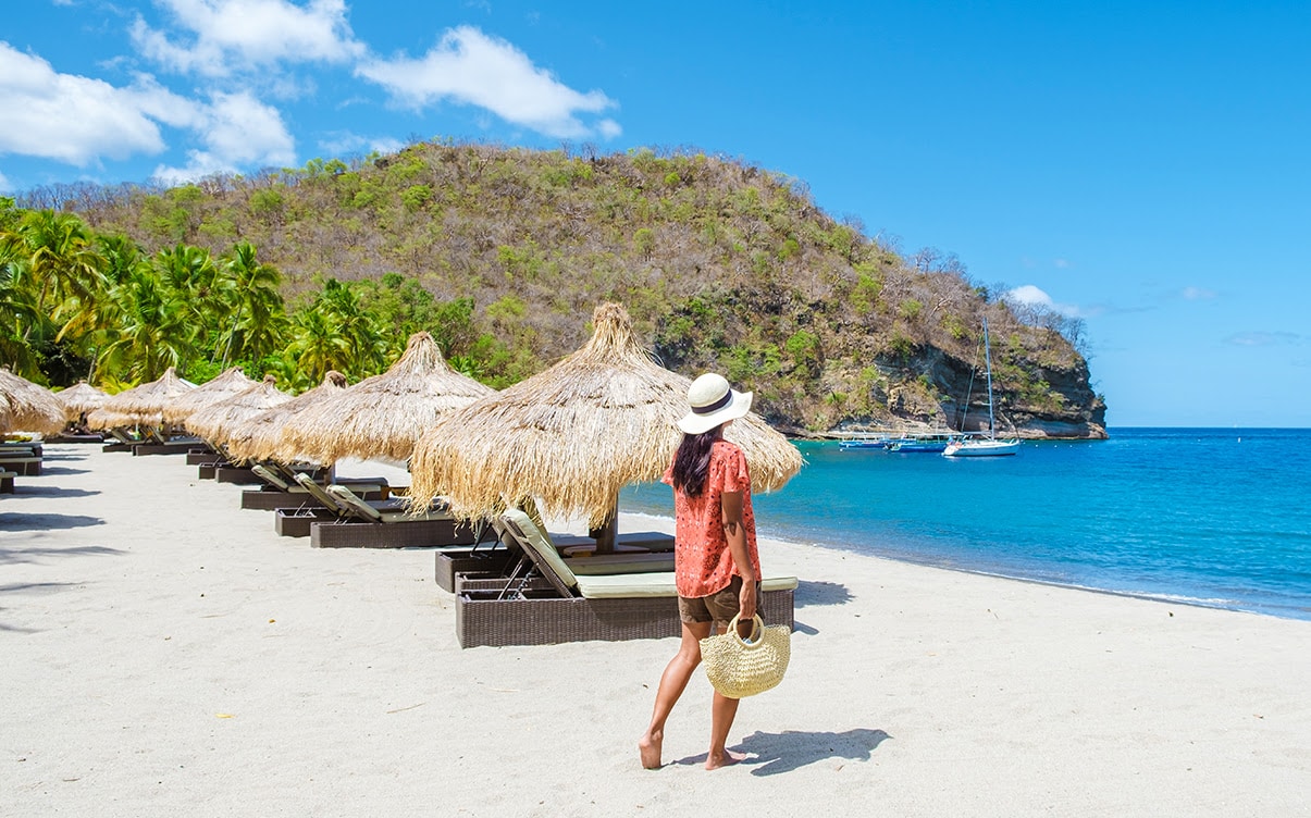 A Woman Walking on a Tropical Beach