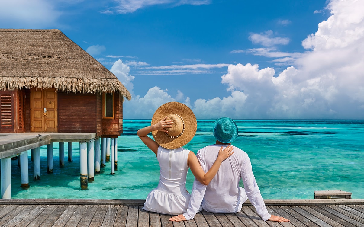 A Couple at an Overwater Bungalow Resort