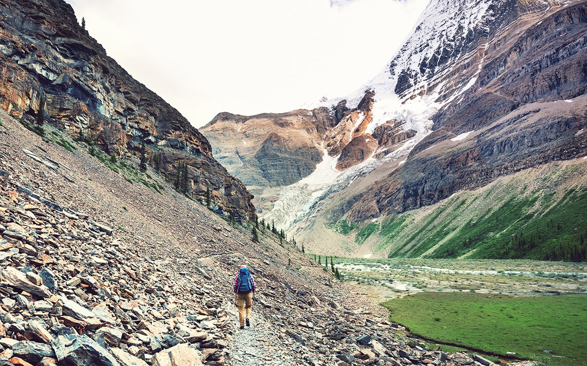 A Man Hiking in the Mountains of Canada