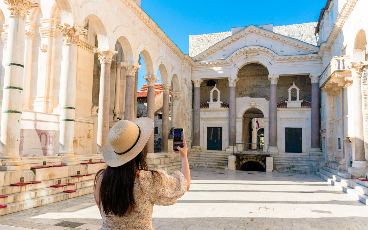 A Woman Taking Photos of Diocletian's Palace