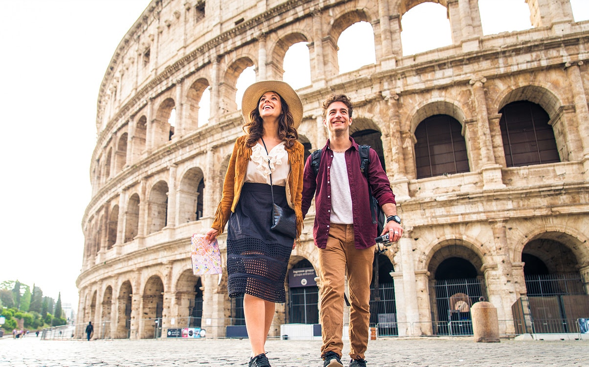 A Couple Walking Outside the Colosseum in Rome