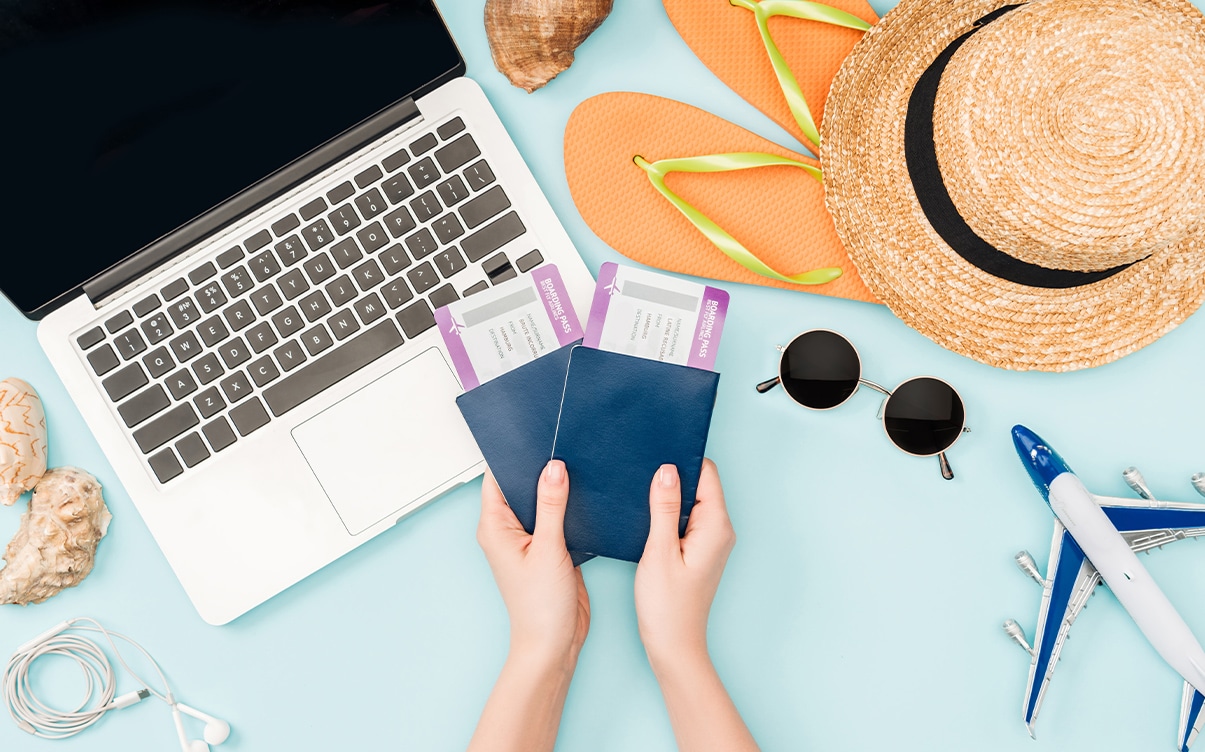 A Person Holding Airline Tickets and Passports