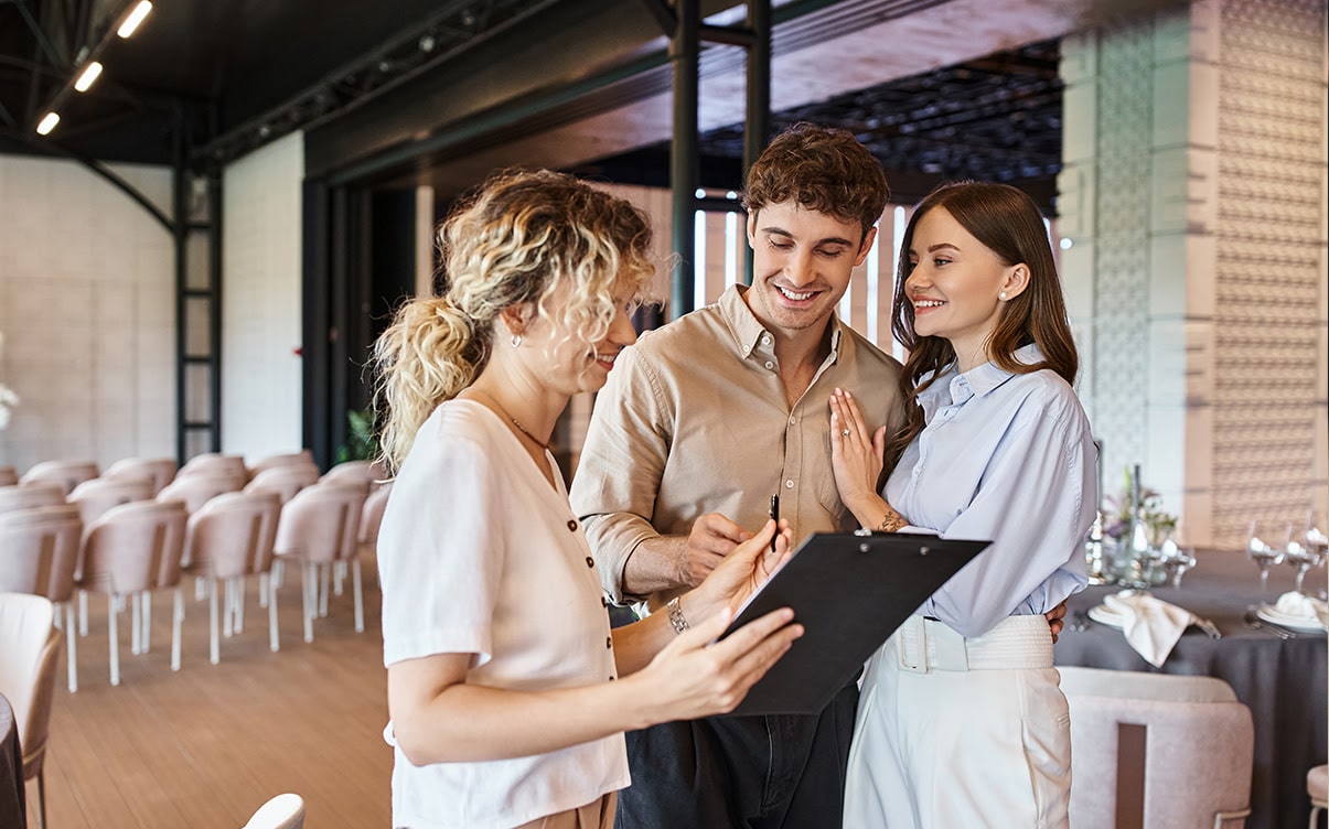 A Couple Meeting With a Wedding Planner