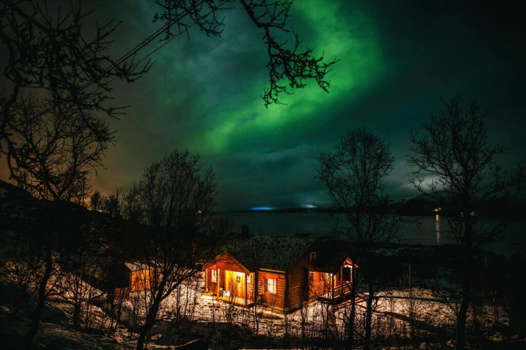Northern Lights above Cabin in Tromsø Norway
