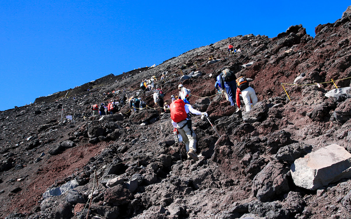 A Group of People Climbing Mt Fuji