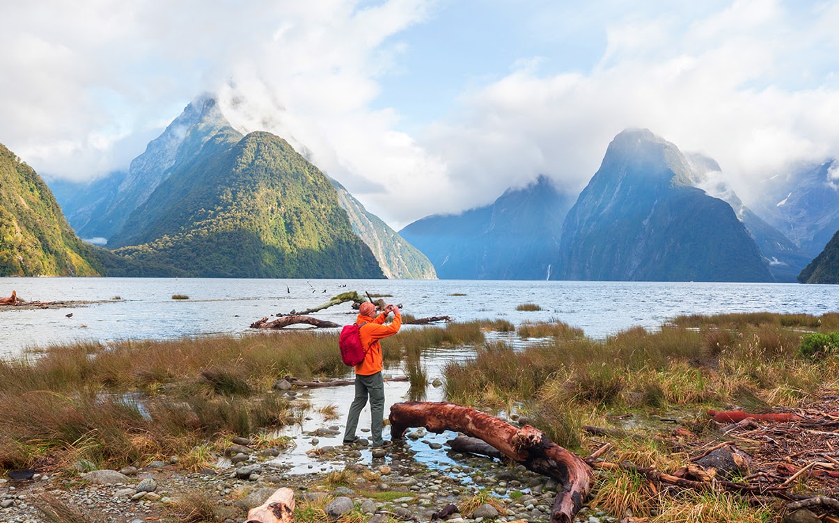 A Man in Milford Sound in New Zealand