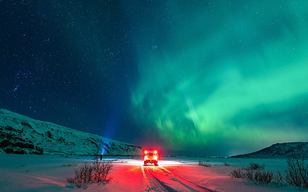 A Person Viewing the Northern Lights in the Winter