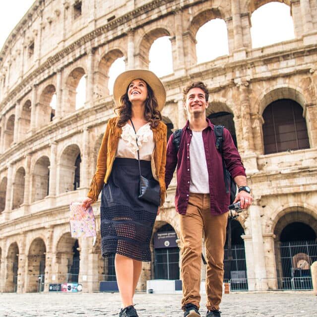 A Couple Walking Outside the Colosseum in Rome