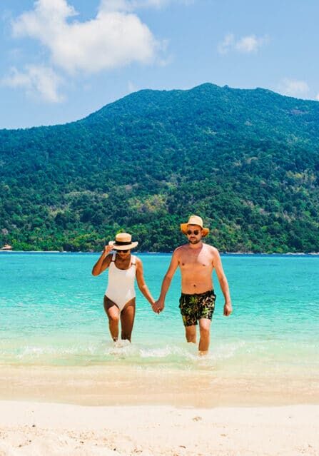 A Couple Walking on a Tropical Beach