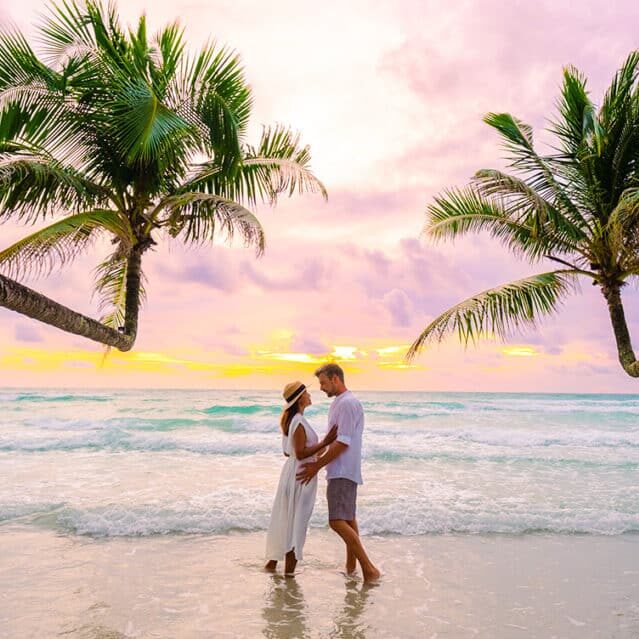 A Couple on a Beach at Sunset