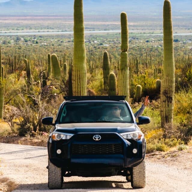 A Person Road Tripping Through a Desert